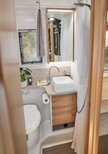 Bailey Adamo 75-4DL mid washroom featuring vanity cupboard with mirrored door and toothbrush holder